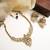 Gold plated gaj necklace set with white hydra beads