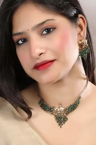 Gold plated gaj necklace set with green hydra beads