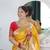 yellow paithani silk blend zari motifs saree with contrast blouse