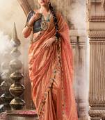 Peach  tissue woven with multicolored lace border saree with blouse