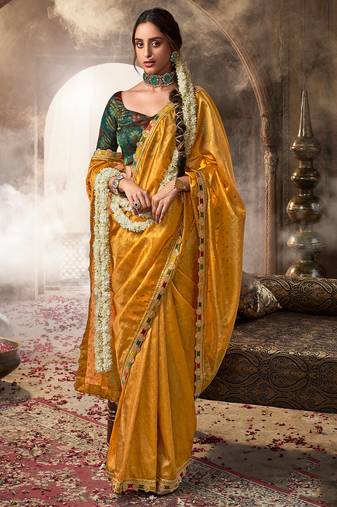 Mustard  tissue woven with multicolored lace border saree with blouse