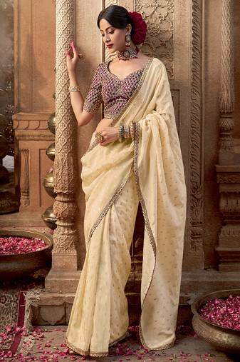 Cream  viscose crepe hand dying and butti weaving with saree with embroidered blouse 