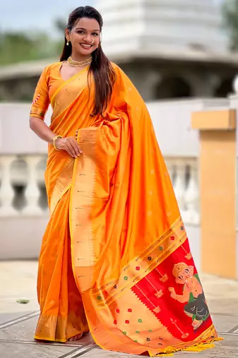 Orange silk blend saree with paithani rich weaved pallu and blouse