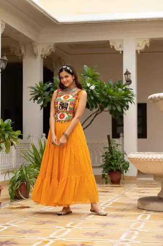 Yellow faux georgette badhni print with kutchi patche work navratri gown