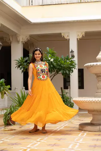 Yellow faux georgette badhni print with kutchi patche work navratri gown