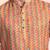 Orange cotton blend short kurta for men with printed design