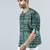 Green cotton blend short kurta for men with printed design