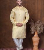 Yellow dupion kurta churidar set for men with solid print