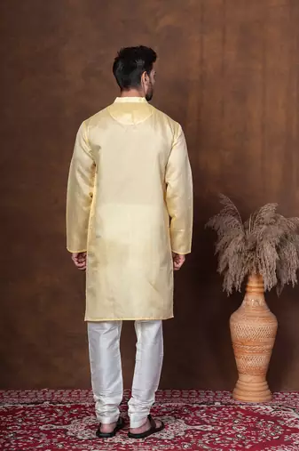 Yellow dupion kurta churidar set for men with solid print
