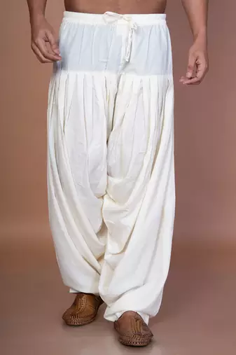 Cream cotton patiala for men with solid design