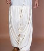 Cream cotton patiala for men with solid design