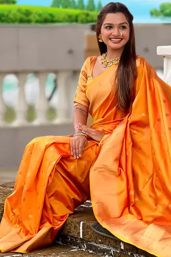 Orange silk blend saree with paithani rich weaved pallu and blouse