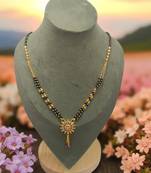Elegant gold-plated sunflower pendant mangalsutra for women – traditional ad stone jewelry with black beads"