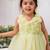 Light green organza woven daffodil frock for girls