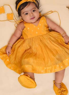 Yellow tissue printed sitara frock for girls 1