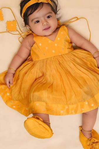 Yellow tissue printed sitara frock for girls