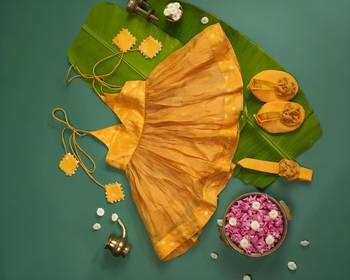 Yellow tissue printed sitara frock for girls 2