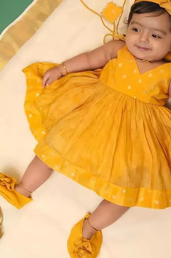 Yellow tissue printed sitara frock for girls