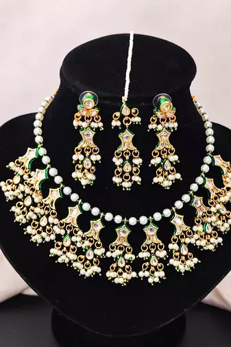 Beautiful kundan pearl and green pearls necklace set with maang tikka & earrings