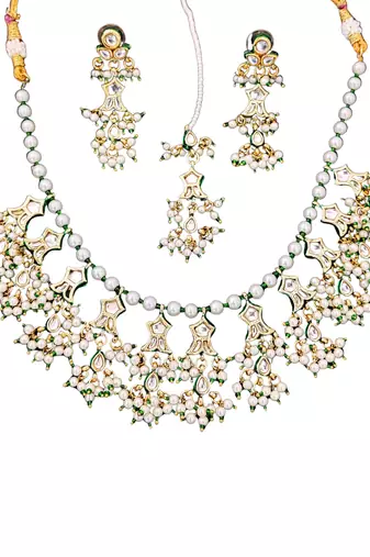 Beautiful kundan pearl and green pearls necklace set with maang tikka & earrings