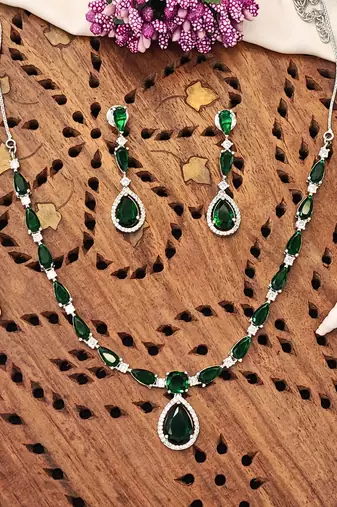 Delicate emerald green stone necklace set with matching drop earrings