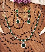Delicate emerald green stone necklace set with matching drop earrings