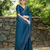 Teal rangoli diamond embellishments saree
