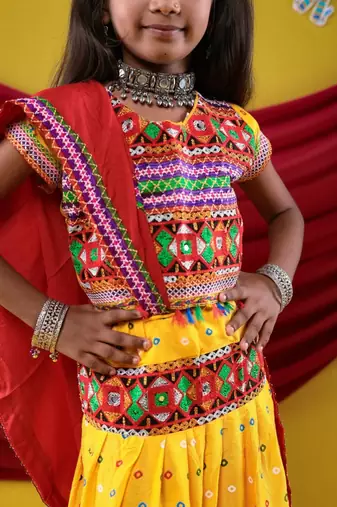 Navratri theme cotton half sleeves kutch work embroidered lehenga choli with dupatta - yellow