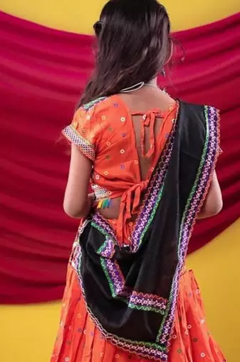 Navratri theme cotton half sleeves kutch work embroidered lehenga choli with dupatta - orange