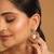 gold plated cubic zirconia studded contemporary moon shaped pearl drop chandbalis