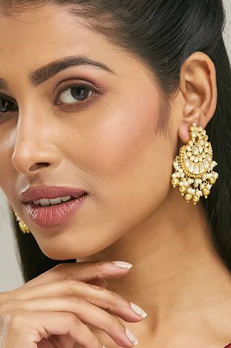 gold plated kundan stone studded & pearl drop beaded crescent shaped chandbalis