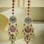 gold plated kundan studded & pearl beaded crescent shaped kanauti earrings