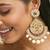 gold plated elegant ruby & kundan stone studded with pearl beaded floral chandbalis