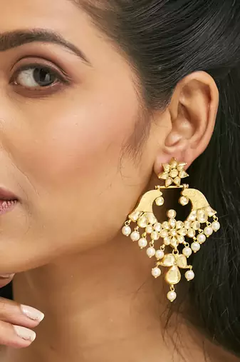 gold plated kundan and pearl earrings with floral stud and intricate crescent design chandbalis