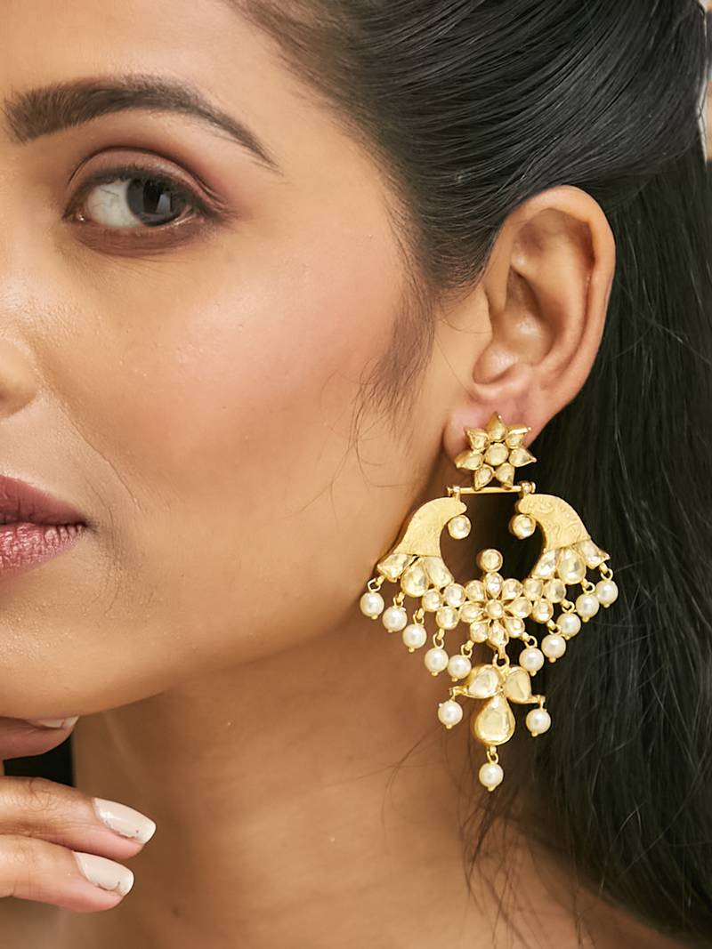 gold plated kundan and pearl earrings with floral stud and intricate crescent design chandbalis