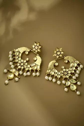 gold plated kundan and pearl earrings with floral stud and intricate crescent design chandbalis