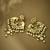 gold plated kundan and pearl earrings with floral stud and intricate crescent design chandbalis