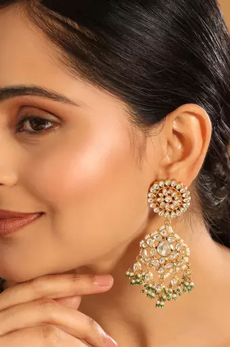 gold plated traditional kundan studded contemporary dangler earrings with pearl and green bead accents