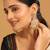 gold plated traditional kundan studded contemporary dangler earrings with pearl and green bead accents