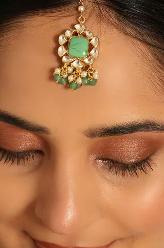 22k gold-plated kundan & green stone embellished maang tikka head jewellery