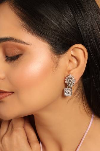 Rhodium plated rhinestone studded floral minimal cotemporary studs