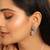 Rhodium plated rhinestone studded floral minimal cotemporary studs