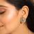 gold plated mother of pearls and stone studded contemporary floral shaped studs