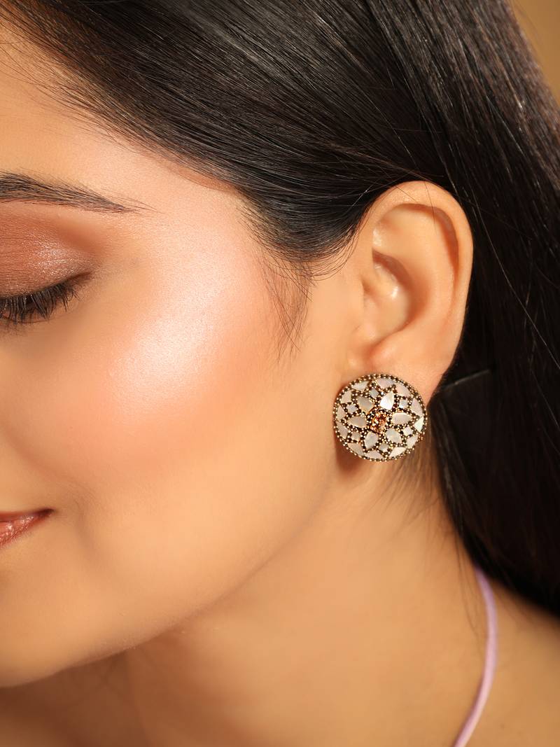gold plated mother of pearls and stone studded contemporary floral shaped studs