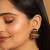 gold plated crystal studded contemporary floral shaped stud earrings