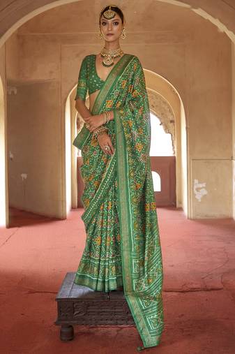 Green poly viscose silk patola printed saree with heavy dimond swarovski work border