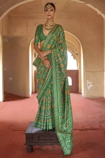 Green poly viscose silk patola printed saree with heavy dimond swarovski work border