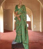 Green poly viscose silk patola printed saree with heavy dimond swarovski work border