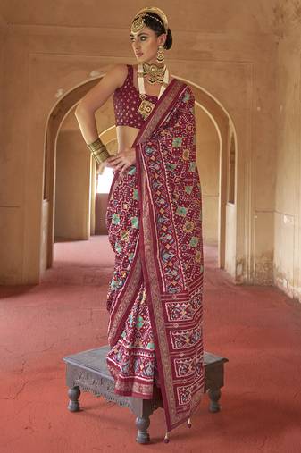 Maroon poly viscose silk patola printed saree with heavy dimond swarovski work border