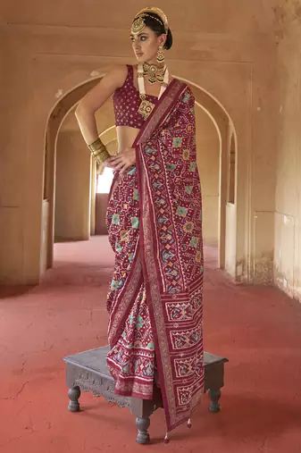 Maroon poly viscose silk patola printed saree with heavy dimond swarovski work border
